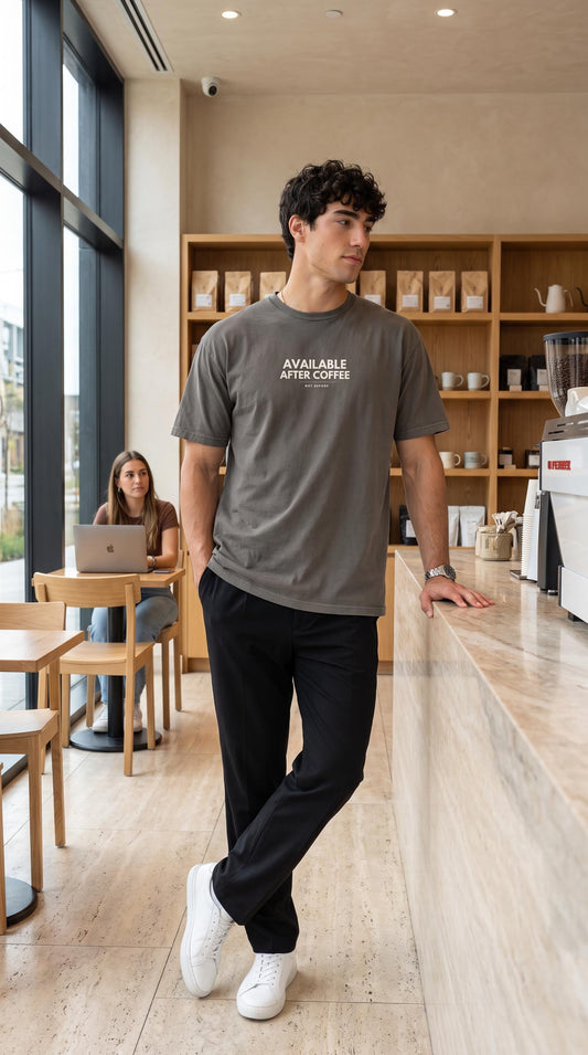 Available After Coffee slogan tee worn in a coffee shop