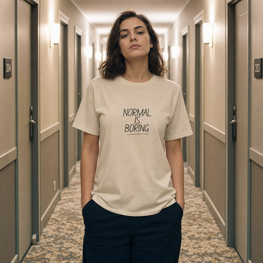 Normal Is Boring tee worn in a hotel corridor of identical doors