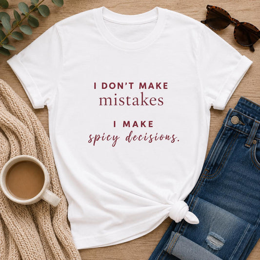 I Don't Make Mistakes I Make Spicy Decisions tee styled flat with coffee and jeans