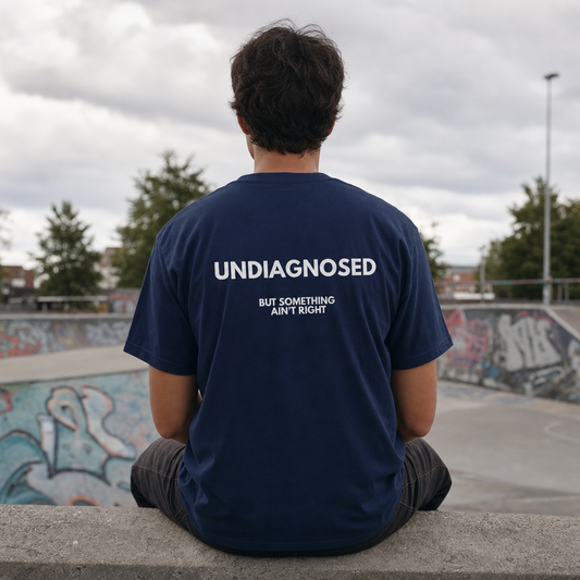Undiagnosed But Something Ain't Right tee, back print, at a skatepark