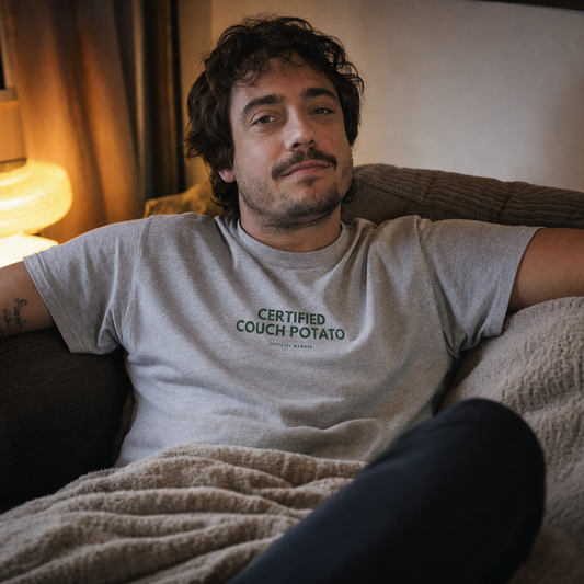 Certified Couch Potato tee worn on a sofa at home