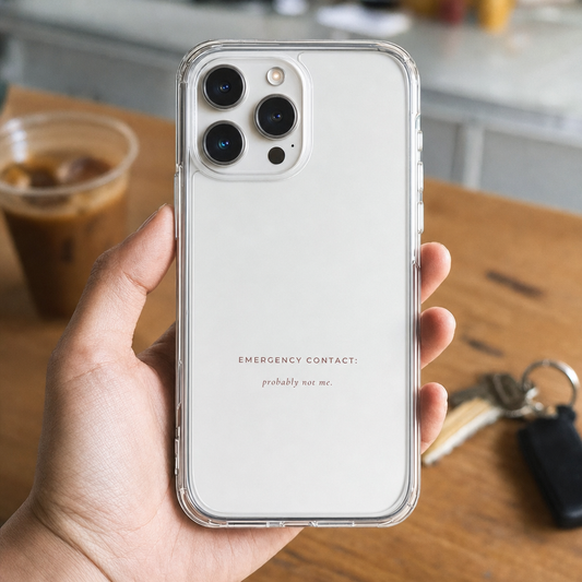 Clear iPhone case printed “Emergency contact: probably not me” in dark rose lettering