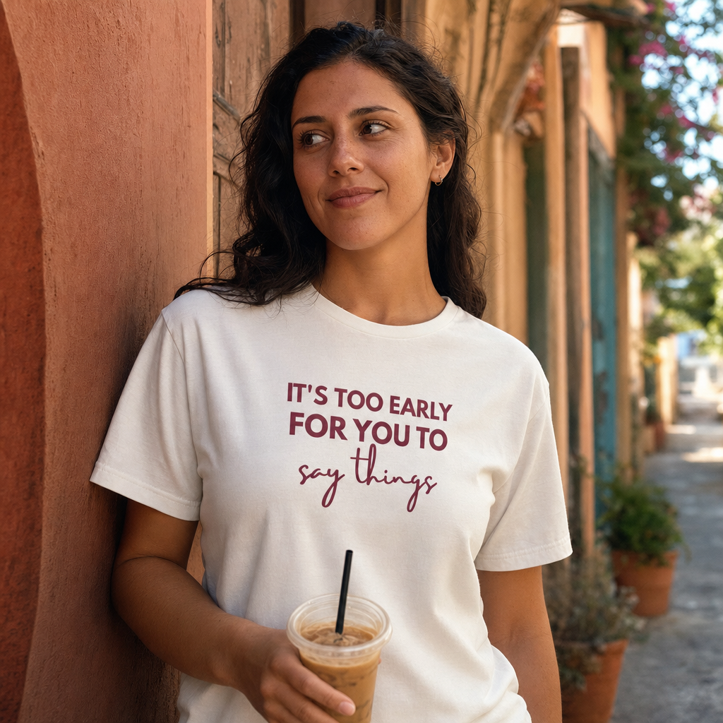 It's Too Early For You To Say Things tee worn in a sunlit alley with an iced coffee