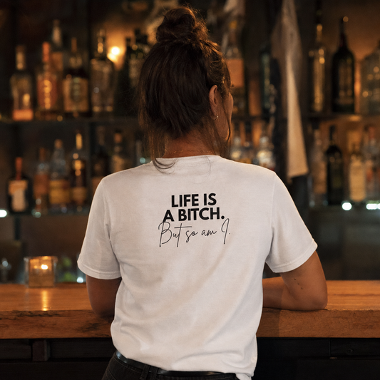 Life Is a Bitch But So Am I tee, back print, at a bar counter